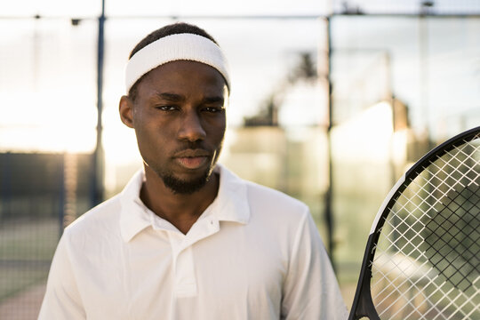 Black tennis player with tennis racket