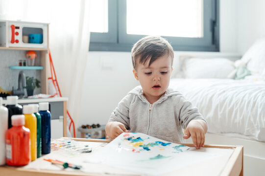 Cute kid with his painting.