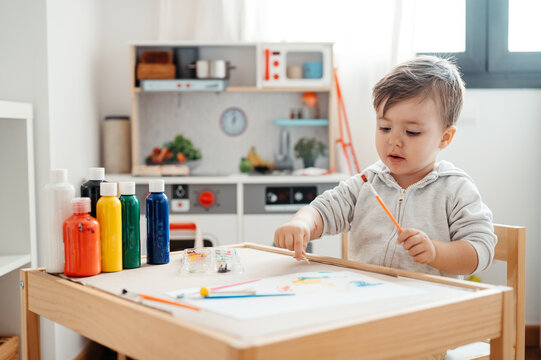 Kid Painting At Home.