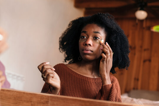 Young woman with eye pads