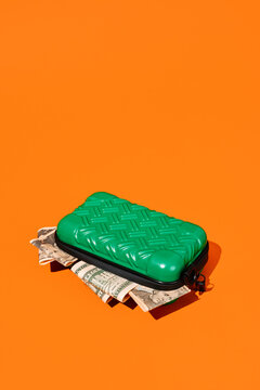 dollar banknotes in a small suitcase