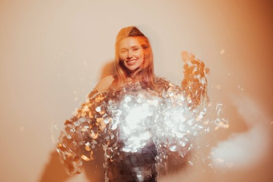 Dancing woman in sequins dress