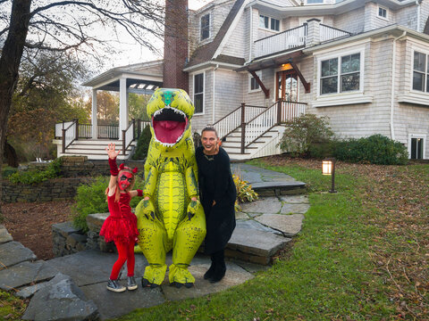 Mother with Children in Halloween Costumes 