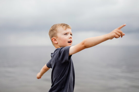 portrait series of a boy by a lake