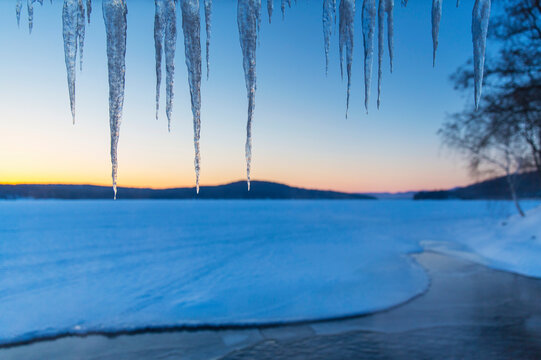  Winter landscape with lake and icicles