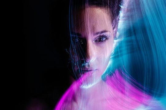 a woman face in blue and purple tones