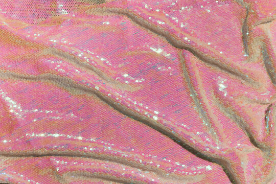 Shiny pink and green sequin background