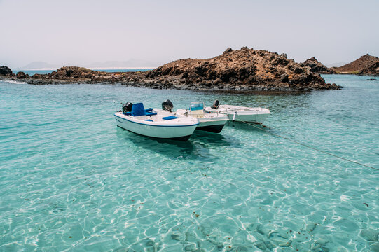 Boats floating in bay in sea of Fuerteventura