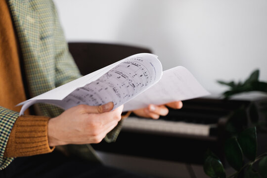 Musician Holding Music Notes 