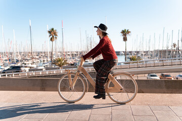 Female cyclist riding lumber bike in city