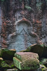 Ruins of a an ancient temple near Angkor Wat in Siem Reap Cambodia - stone carving from centuries ago
