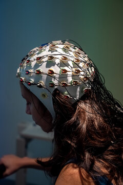 Female in EEG cap doing brain analysis