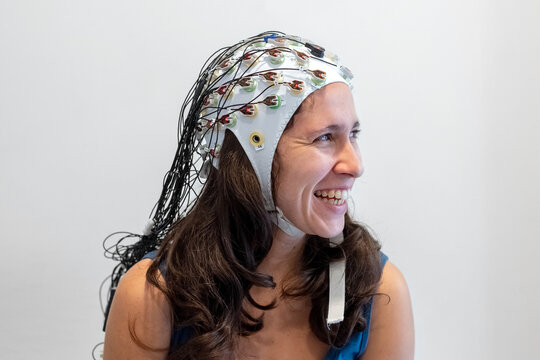 Woman in EEG cap before a procedure