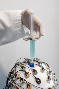Patient in EEG cap getting a procedure in clinic