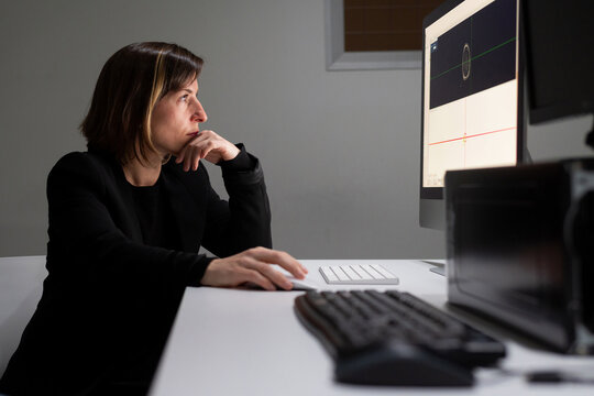 Woman researcher analyzing brain scans