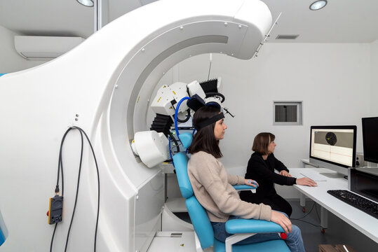 Patient doing TMS in modern laboratory