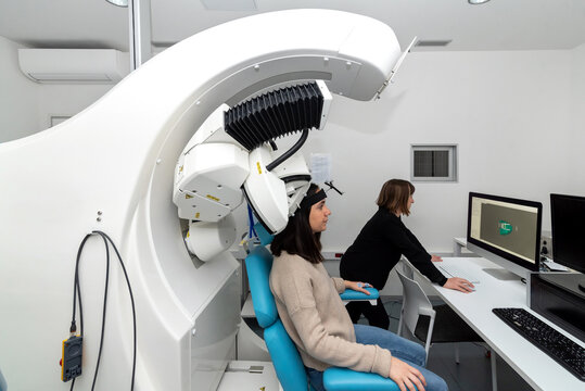 Patient doing TMS in modern laboratory