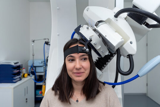 Woman patient receiving TMS procedure