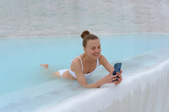 a girl in a white pool of warm springs