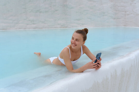 a woman with a phone in warm springs