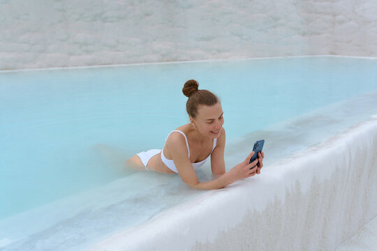 a woman with a phone in warm springs