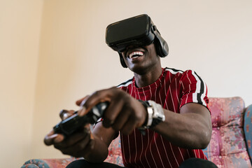 Happy black gamer in VR headset