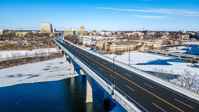Snow covers landscape into the city
