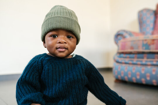 Black baby looking at camera