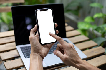 man hand using smartphone In the coffee shop,Screen blank with clipping path
