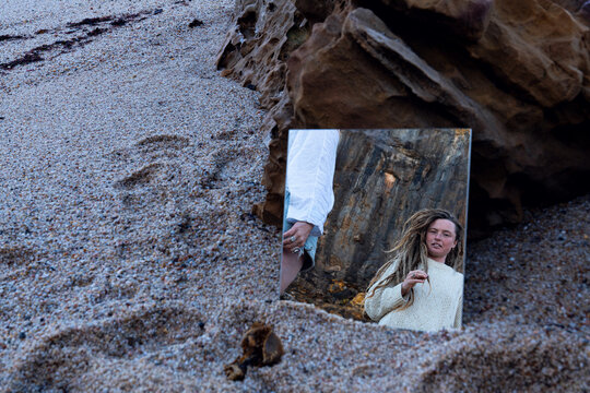 Friendship or love in a mirror on a beach 