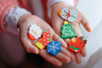 Christmas gift eraser in child's hand