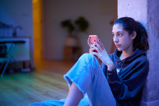 Teenager texting bymobile phone