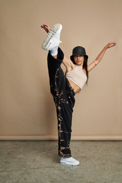Hispanic woman with hat dancing