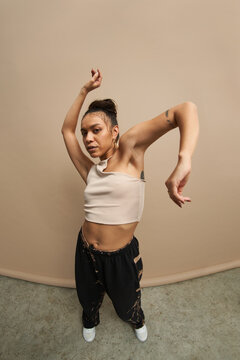 Hispanic female dancer looking at camera