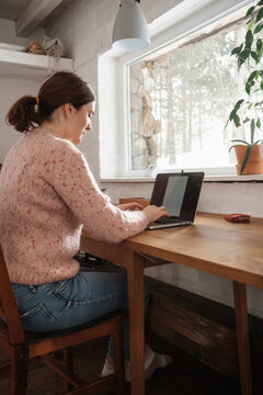 Woman Working On The Laptop In The Winter Time