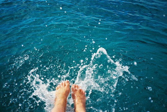 Feet Kicking In Ocean