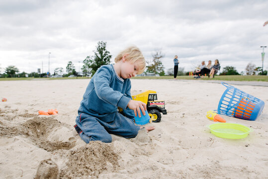 Boy In Sand Pit