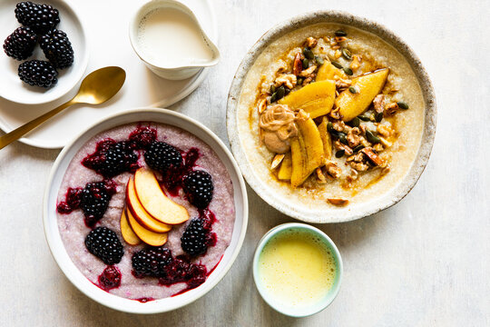 Quinoa breakfast porridge with fruits, berries, nuts, seeds