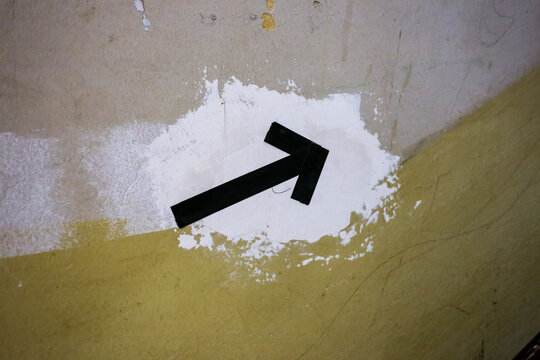 Signpost on a house wall