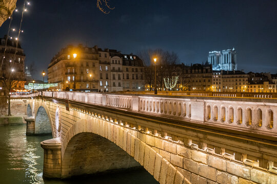 Bridge over river in night city