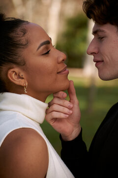 Close up of an Interracial young couple at the park