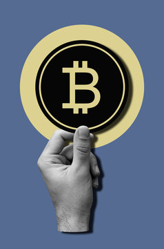 Hand Holding Bitcoin On Blue Background