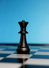 queen chess piece on chessboard