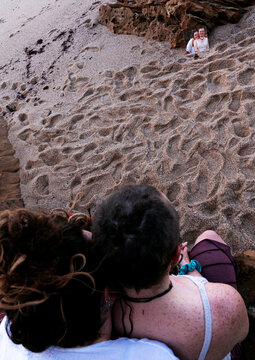 Friendship in a mirror on a beach 