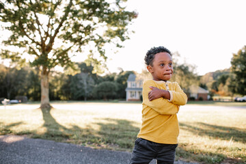 Young Boy With Down Syndrome Outside