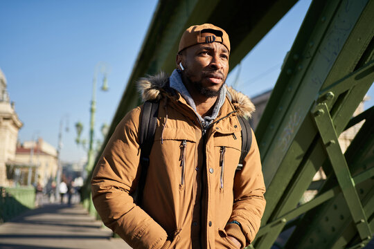 Man in outerwear walking on street