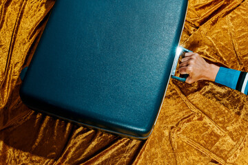 man with a retro blue suitcase