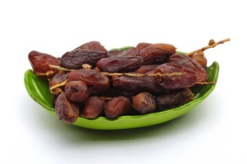 Dates Fruits on a plate isolated white background