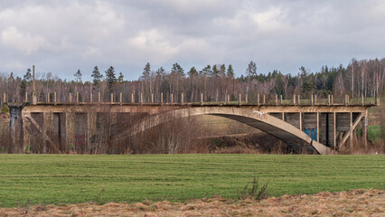 abandoned unfinished bridge over the river