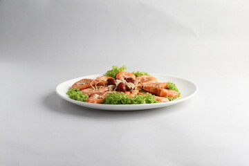 steamed fresh poached tiger prawn with vegetable lettuce on white plate background chinese banquet halal seafood menu